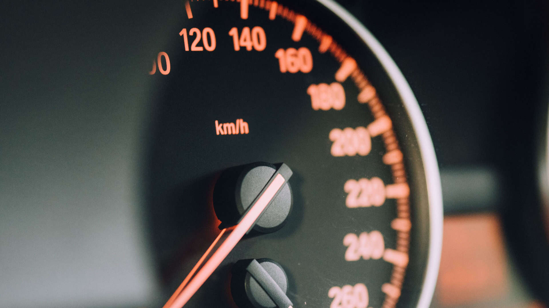 close up of an analogue car speedometer